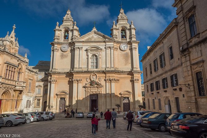 Best of Mdina and Rabat Walking Tour - Starting at Mdina Gate with a red umbrella