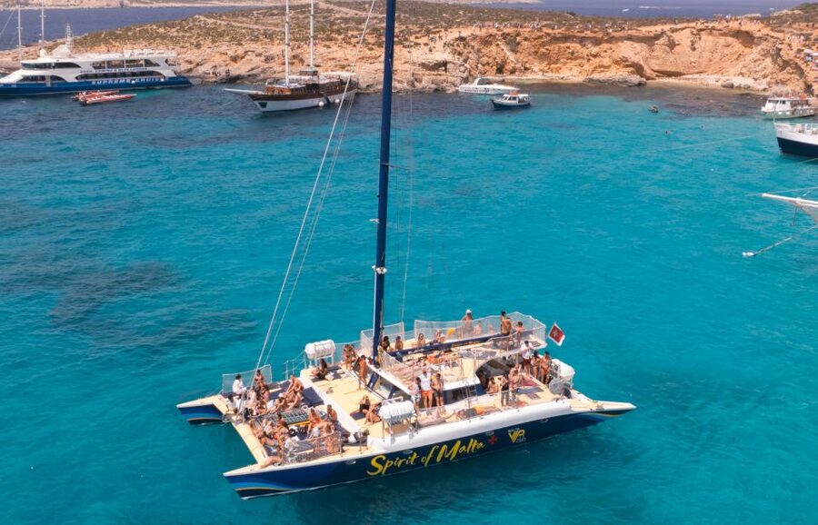 Comino: Blue Lagoon Catamaran Cruise with Lunch and Open Bar - From calm sailing to a party at sea
