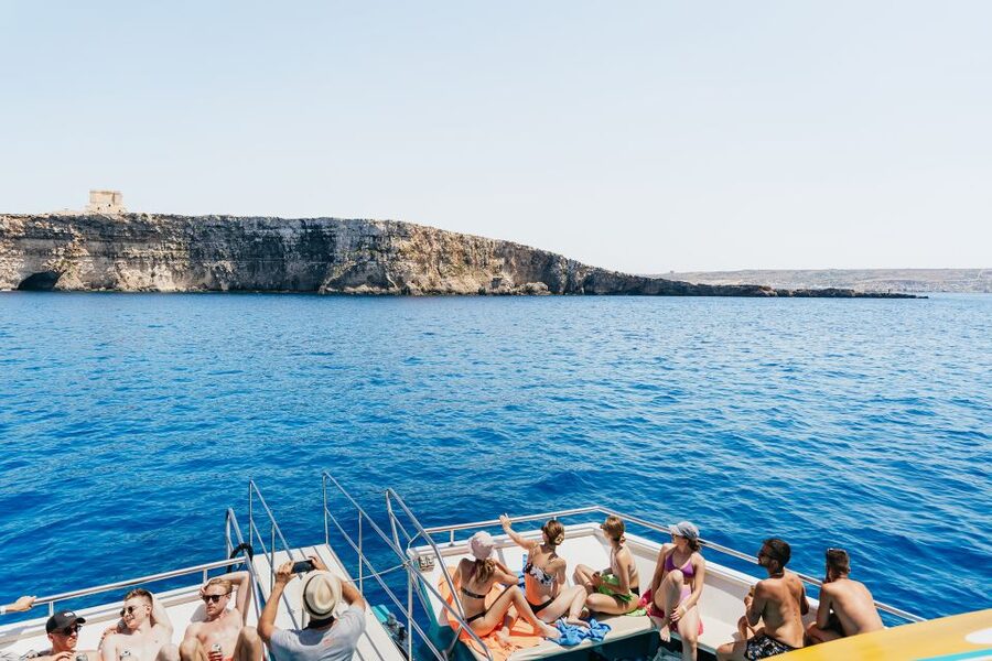 Comino: Blue Lagoon, Crystal Lagoon, and Seacaves Tour - The waterslide turns a calm cruise into a family day