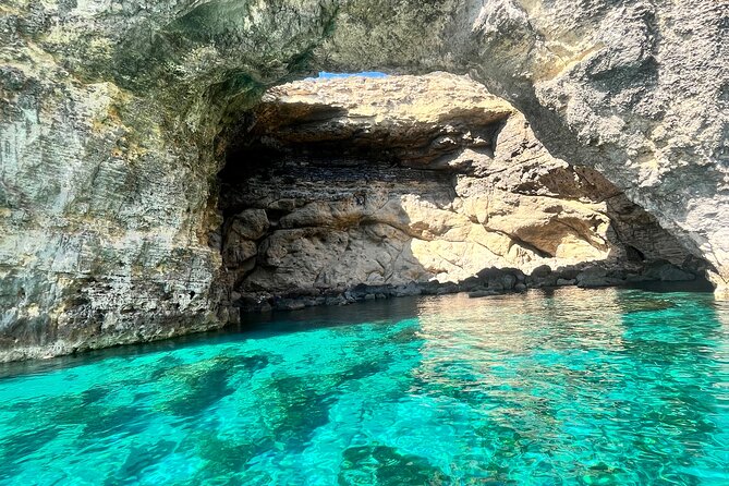 Explore Comino, Blue Lagoon & Caves - Private speed boat - Half Rock and the view toward Gozo