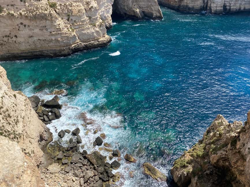 From Sliema: Blue Grotto Trip - Including Boat Cave Tour - Walking toward Xutu Tower