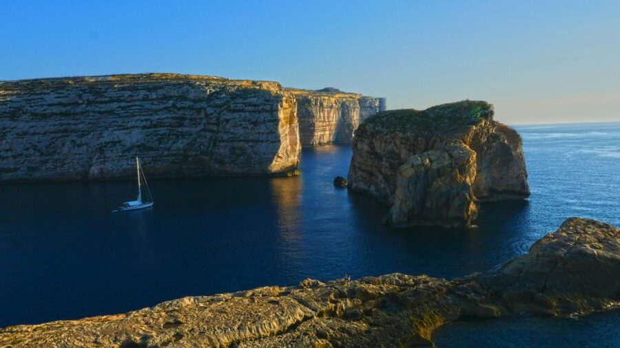 Gozo Day Pass Ferry and Hop-on Hop-off buses with audio Tour - The audio guide and open-top bus experience