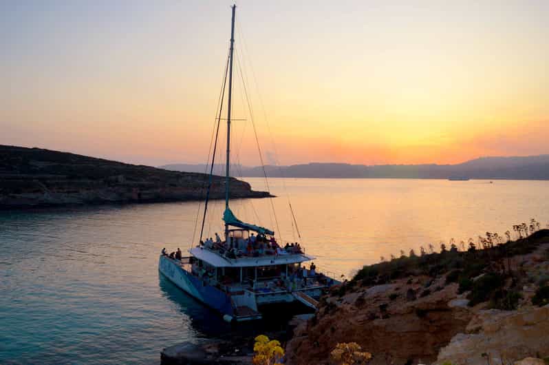 Malta: Blue Lagoon Evening Catamaran Cruise - Anchor Bay and Popeye’s Village from the water