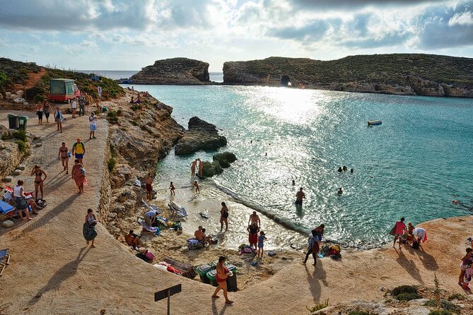 Malta Sunset Boat Tour: Bugibba to Comino Blue Lagoon Cruise - Food, cocktails, and the return under the stars