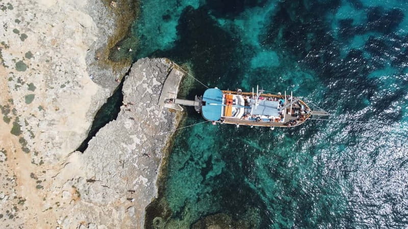 Malta: Sunset Cruise to Blue Lagoon and Caves - Leaving Bugibba and passing St. Paul’s Island