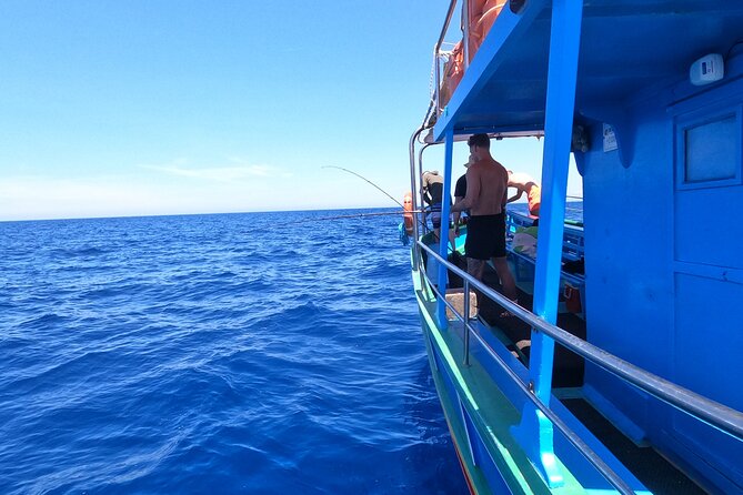 Private Boat charter to Crystal & Blue Lagoon, Caves & Comino - Crystal Lagoon, cliffs, and a cave with a sandy beach
