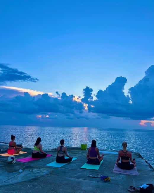 Sliema: Beach Yoga Class with Swimming - Yoga beside the water at Sliema Chalet