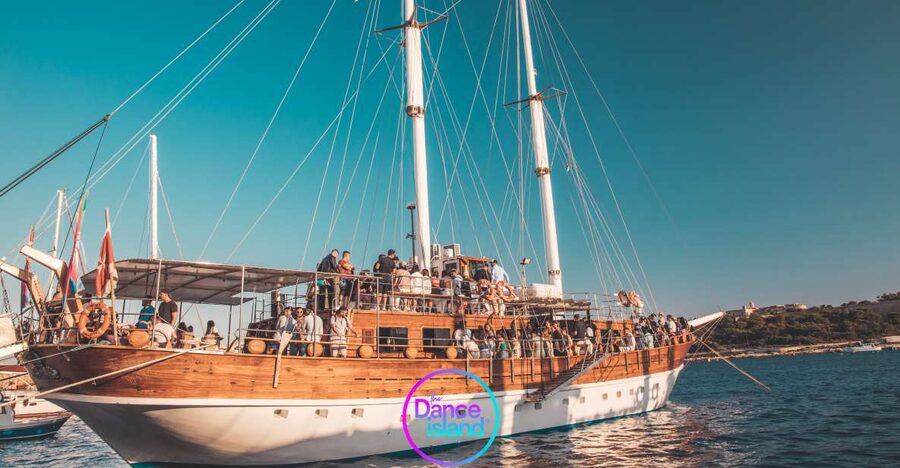 Sliema: Sailboat Party with an Open Bar, Food, and Swimming - Leaving Sliema with the DJ on deck